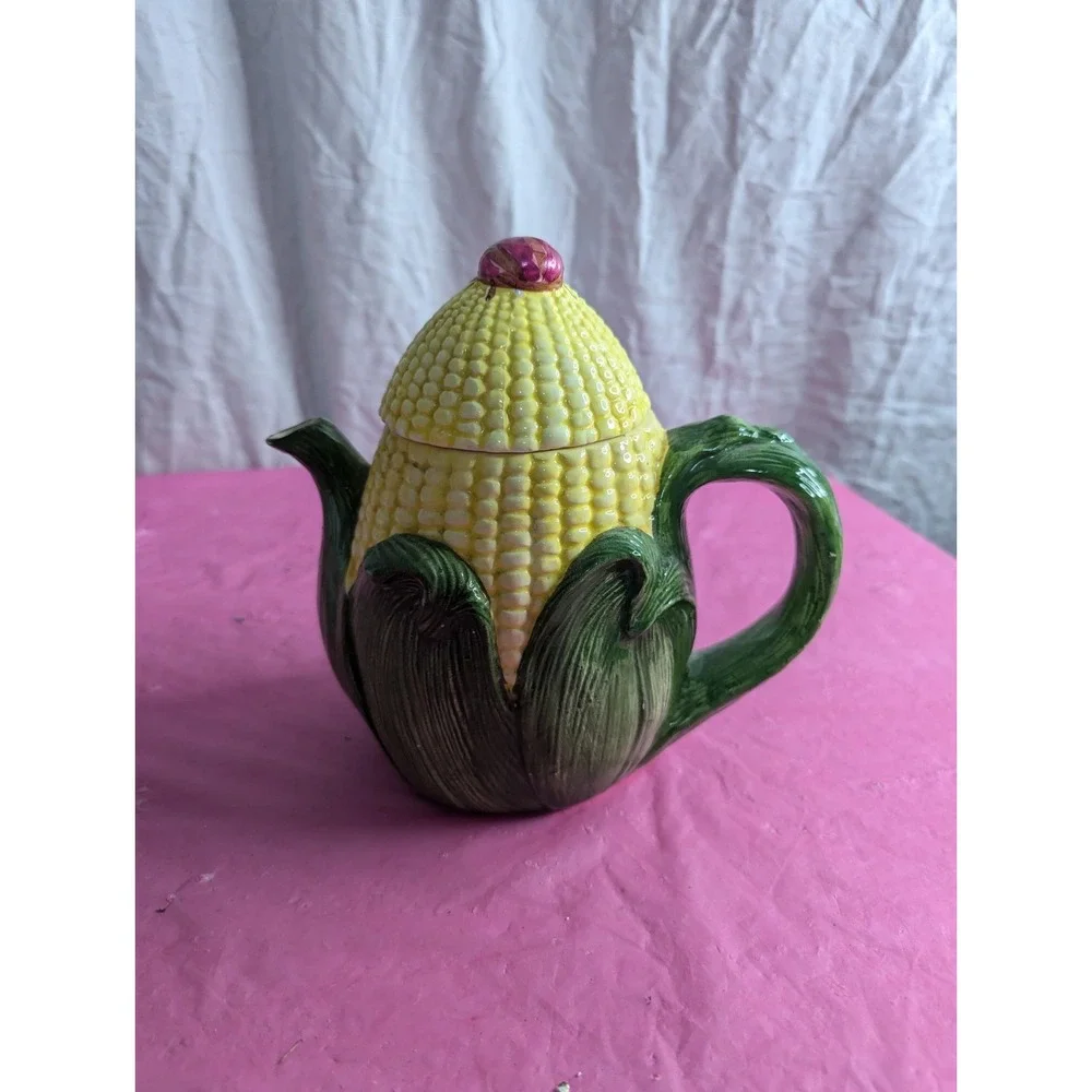 Corn husk teapot with lady bug beetle ? at top 7.5